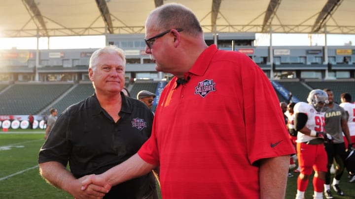 January 17, 2015; Carson, CA, USA; National head coach Mike Martz meets with American head coach following the NFLPA Collegiate Bowl at StubHub Center. Mandatory Credit: Gary A. Vasquez-USA TODAY Sports