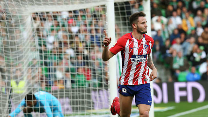 Atletico Madrid's Spanish midfielder Saul Niguez celebrates after scoring a goal during the Spanish league football match between Real Betis and Atletico Madrid at the Benito Villamarin Stadium in Sevilla on December 10, 2017. / AFP PHOTO / CRISTINA QUICLER (Photo credit should read CRISTINA QUICLER/AFP/Getty Images)