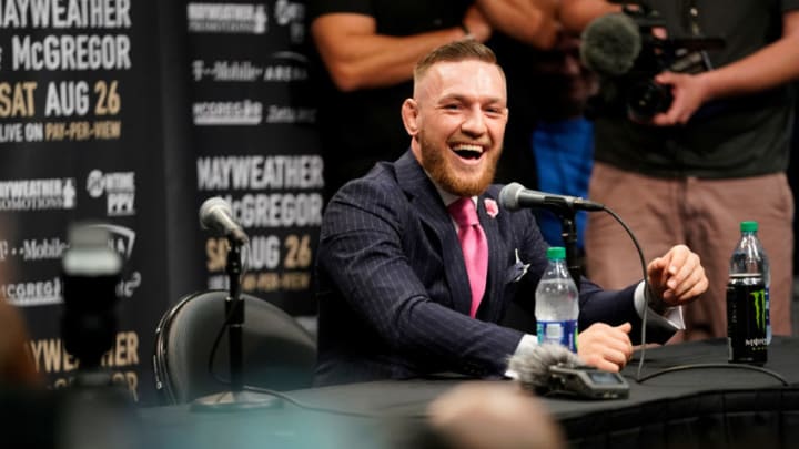 LOS ANGELES, CA - JULY 11: Conor McGregor interacts with Floyd Mayweather Sr. during the Floyd Mayweather Jr. v Conor McGregor World Press Tour event at the Staples Center on July 11, 2017 in Los Angeles, California. (Photo by Jeff Bottari/Zuffa LLC/Zuffa LLC via Getty Images)