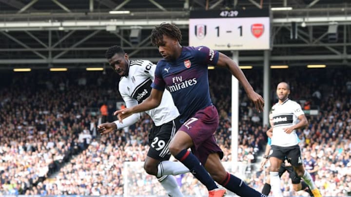 LONDON, ENGLAND - OCTOBER 07: Alex Iwobi of Arsenal takes on Andre-Frank Zambo Anguissa of Fulham during the Premier League match between Fulham FC and Arsenal FC at Craven Cottage on October 7, 2018 in London, United Kingdom. (Photo by David Price/Arsenal FC via Getty Images)