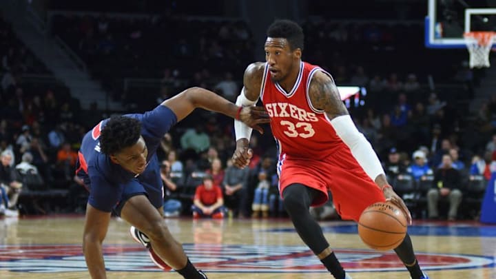Dec 11, 2016; Auburn Hills, MI, USA; Philadelphia 76ers forward Robert Covington (33) drives to the basket as Detroit Pistons forward Stanley Johnson (7) defends during the third quarter at The Palace of Auburn Hills. Mandatory Credit: Tim Fuller-USA TODAY Sports