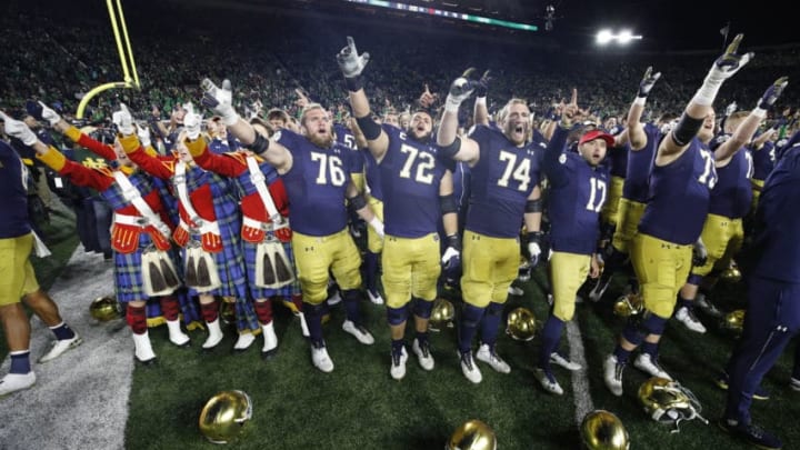 SOUTH BEND, IN - OCTOBER 12: Notre Dame Fighting Irish players celebrate after the game against the USC Trojans at Notre Dame Stadium on October 12, 2019 in South Bend, Indiana. Notre Dame defeated USC 30-27. (Photo by Joe Robbins/Getty Images)