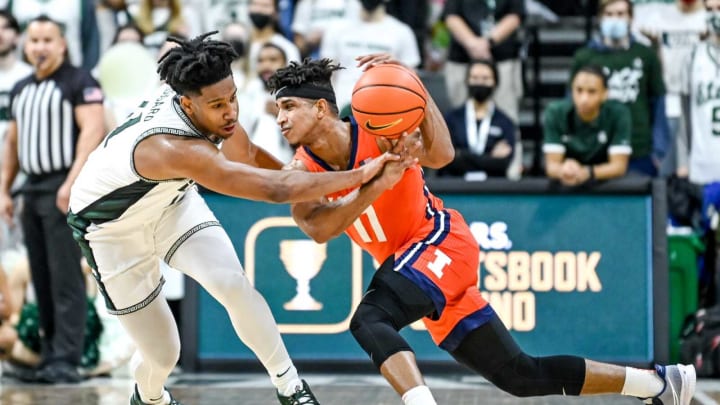 Michigan State’s A.J. Hoggard, left, pressures Illinois’ Alfonso Plummer during the first half on Saturday, Feb. 19, 2022, at the Breslin Center in East Lansing.220219 Msu Illinois 141a
