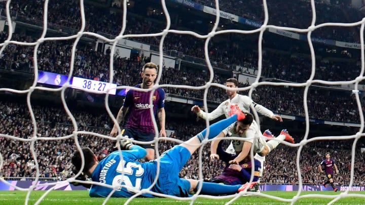 Barcelona’s Croatian midfielder Ivan Rakitic (C) scores a goal during the Spanish league football match between Real Madrid CF and FC Barcelona at the Santiago Bernabeu stadium in Madrid on March 2, 2019. (Photo by JAVIER SORIANO / AFP) (Photo credit should read JAVIER SORIANO/AFP/Getty Images)