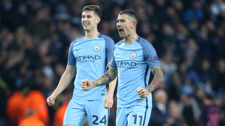 MANCHESTER, ENGLAND - NOVEMBER 1: Aleksandar Kolarov and John Stones of Manchester City (left) celebrate winning following the UEFA Champions League match between Manchester City FC and FC Barcelona at Etihad Stadium on November 1, 2016 in Manchester, England. (Photo by Jean Catuffe/Getty Images)