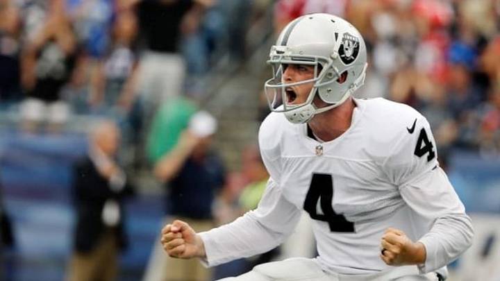 Sep 21, 2014; Foxborough, MA, USA; Oakland Raiders quarterback Derek Carr (4) celebrates during the fourth quarter against the New England Patriots at Gillette Stadium. Mandatory Credit: Winslow Townson-USA TODAY Sports