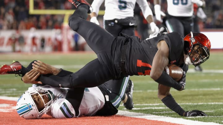 HOUSTON, TX – NOVEMBER 15: Isaiah Johnson #14 of the Houston Cougars is tackled after an interception by Justin McMillan #12 of the Tulane Green Wave in the second quarter at TDECU Stadium on November 15, 2018 in Houston, Texas. (Photo by Tim Warner/Getty Images)