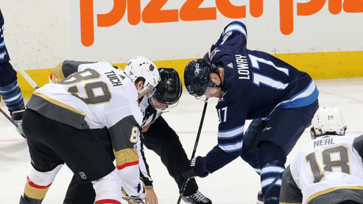 WINNIPEG, MB - DECEMBER 1: Alex Tuch #89 of the Vegas Golden Knights wins a third period face-off against Adam Lowry #17 of the Winnipeg Jets at the Bell MTS Place on December 1, 2017 in Winnipeg, Manitoba, Canada. (Photo by Jonathan Kozub/NHLI via Getty Images)