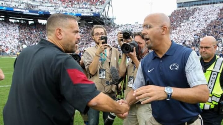 Sep 17, 2016; University Park, PA, USA; Penn State Nittany Lions head coach James Franklin (right) shakes hands with Temple Owls head coach Matt Rhule (left) following the completion of the game at Beaver Stadium. Penn State defeated Temple 34-27. Mandatory Credit: Matthew O’Haren- USA TODAY Sports