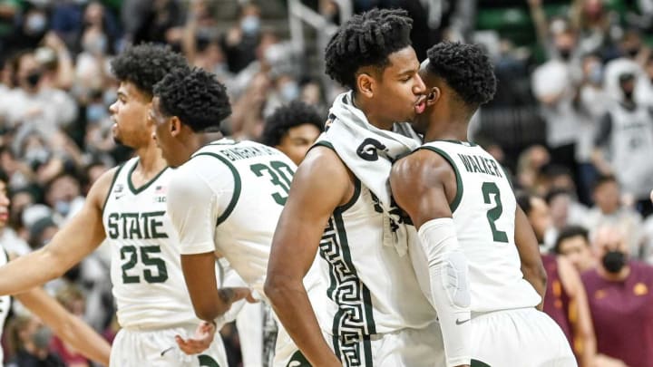Michigan State’s Tyson Walker, right, celebrates with A.J. Hoggard, left, after Walker’s 3-pointer against Minnesota during the second half on Wednesday, Jan. 12, 2022, at the Breslin Center in East Lansing.220112 Msu Minn 144a