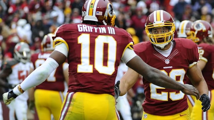 Nov 16, 2014; Landover, MD, USA; Washington Redskins running back Roy Helu (29) celebrates with quarterback Robert Griffin III (10) after scoring a touchdown against the Tampa Bay Buccaneers during the first half at FedEx Field. Mandatory Credit: Brad Mills-USA TODAY Sports