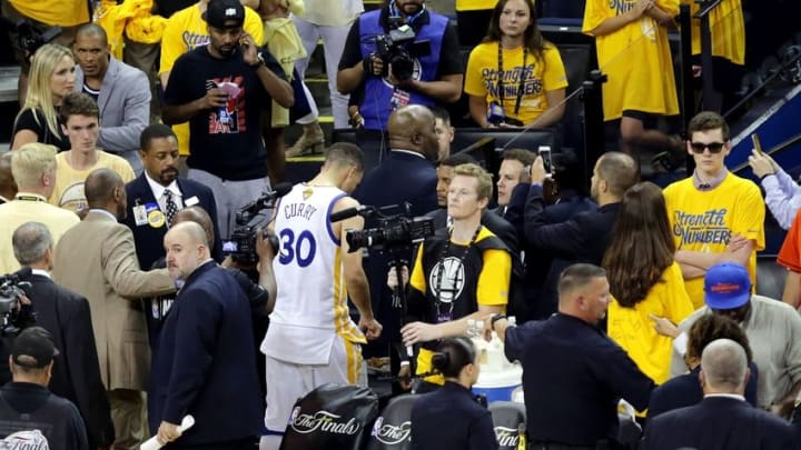 Jun 19, 2016; Oakland, CA, USA; Golden State Warriors guard Stephen Curry (30) leaves the court after game seven of the NBA Finals against the Cleveland Cavaliers at Oracle Arena. Mandatory Credit: Kelley L Cox-USA TODAY Sports