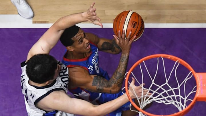 Philippines' Jordan Clarkson (top) goes for the basket against South Korea in the men's basketball quarter-final match between South Korea and the Philippines during the 2018 Asian Games in Jakarta on August 27, 2018. (Photo by Lillian SUWANRUMPHA / AFP) (Photo credit should read LILLIAN SUWANRUMPHA/AFP/Getty Images)