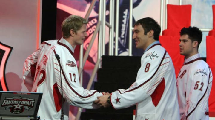 RALEIGH, NC – JANUARY 28: Third pick Alex Ovechkin of the Washington Capitals for team Staal is greeted by Eric Staal (L) of the Carolina Hurricanes as Mike Green (R) of the Washington Capitals looks on during the All-Star Fantasy Draft for the 2011 NHL All-Star Weekend at the Raleigh Convention Center on January 28, 2011 in Raleigh, North Carolina. (Photo by Dave Sandford/NHLI via Getty Images)