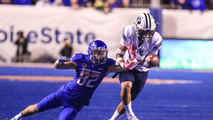 BOISE, ID - OCTOBER 20: Wide receiver Thomas Sperbeck #82 of the Boise State Broncos makes a defensive play knocking away a pass interception by defensive back Troy Warner #11 of the Brigham Young Cougars during first half action on October 20, 2016 at Albertsons Stadium in Boise, Idaho. (Photo by Loren Orr/Getty Images)