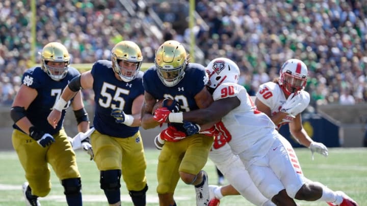SOUTH BEND, INDIANA - SEPTEMBER 14: Chase Claypool #83 of the Notre Dame Fighting Irish runs with the football in the second quarter against Erin Austin #90 of the New Mexico Lobos at Notre Dame Stadium on September 14, 2019 in South Bend, Indiana. (Photo by Quinn Harris/Getty Images)