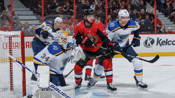 OTTAWA, ON - OCTOBER 10: Chris Tierney #71 of the Ottawa Senators battles for position at the net against Jake Allen #34, Colton Parayko #55 and Jay Bouwmeester #19 of the St. Louis Blues at Canadian Tire Centre on October 10, 2019 in Ottawa, Ontario, Canada. (Photo by Andre Ringuette/NHLI via Getty Images)