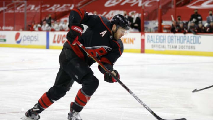 RALEIGH, NORTH CAROLINA – MARCH 04: Jaccob Slavin #74 of the Carolina Hurricanes skates with the puck during the second period of their game against the Detroit Red Wings at PNC Arena on March 04, 2021, in Raleigh, North Carolina. (Photo by Jared C. Tilton/Getty Images)