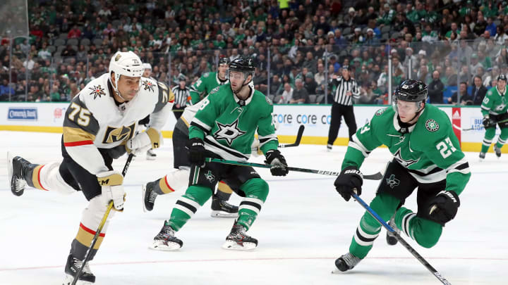 Ryan Reaves of the Vegas Golden Knights shoots the puck against Esa Lindell #23 of the Dallas Stars in the waits for play to begin at American Airlines Center on December 13, 2019.