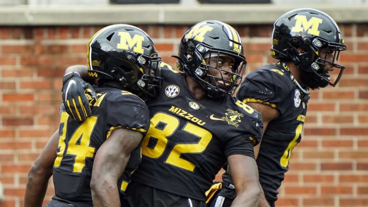 Dec 12, 2020; Columbia, Missouri, USA; Missouri Tigers running back Larry Rountree III (34) celebrates with tight end Daniel Parker Jr. (82) and wide receiver Keke Chism (6) after scoring a touchdown against the Georgia Bulldogs during the first half at Faurot Field at Memorial Stadium. Mandatory Credit: Jay Biggerstaff-USA TODAY Sports