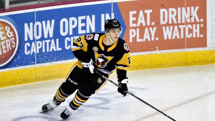 HERSHEY, PA - DECEMBER 21: Wilkes-Barre/Scranton Penguins center Teddy Blueger (23) skates the puck out fo his own end during the Wilkes-Barre/Scranton Penguins at Hershey Bears on December 21, 2018 at the Giant Center in Hershey, PA. (Photo by Randy Litzinger/Icon Sportswire via Getty Images)