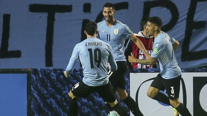 Uruguay's Gaston Pereiro (C) celebrates after scoring against Ecuador during the South American qualification football match for the FIFA World Cup Qatar 2022 at the Campeon del Siglo stadium in Montevideo on September 9, 2021. (Photo by Ernesto Ryan / POOL / AFP) (Photo by ERNESTO RYAN/POOL/AFP via Getty Images)