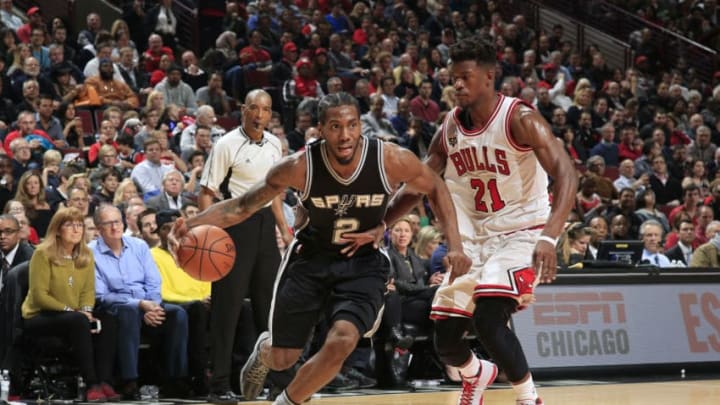 CHICAGO, IL - NOVEMBER 30: Kawhi Leonard #2 of the San Antonio Spurs drives to the basket against Jimmy Butler #21 of the Chicago Bulls during the game on November 30, 2015 at United Center in Chicago, Illinois. NOTE TO USER: User expressly acknowledges and agrees that, by downloading and or using this Photograph, user is consenting to the terms and conditions of the Getty Images License Agreement. Mandatory Copyright Notice: Copyright 2015 NBAE (Photo by Jeff Haynes/NBAE via Getty Images)
