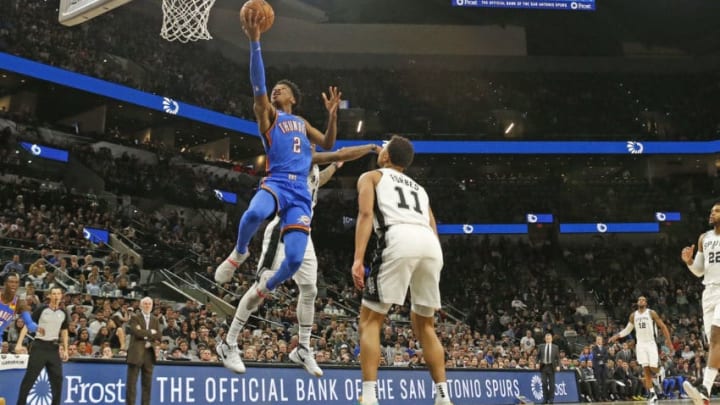 JANUARY 2: Shai Gilgeous-Alexander #2 of the OKC Thunder flies past Bryn Forbes #11 of the San Antonio Spurs during second half . (Photo by Ronald Cortes/Getty Images)