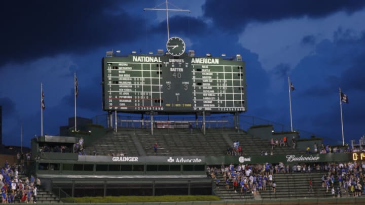 CHICAGO, ILLINOIS - AUGUST 10: A view of the scoreboard just before fans were asked to seek shelter prior to a rain rain delay in Game Two of a doubleheader between the Chicago Cubs and the Milwaukee Brewers at Wrigley Field on August 10, 2021 in Chicago, Illinois. (Photo by Nuccio DiNuzzo/Getty Images)