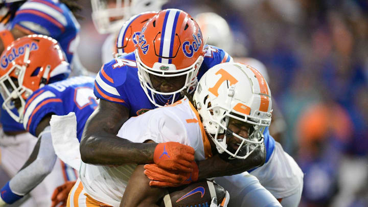 Florida outside linebacker David Reese (4) tackles Tennessee wide receiver Velus Jones Jr. (1) during the first quarter of an NCAA football game against Florida at Ben Hill Griffin Stadium in Gainesville, Florida on Saturday, Sept. 25, 2021.Tennflorida0925 0650