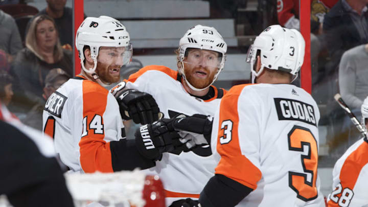 OTTAWA, ON - OCTOBER 10: Sean Couturier #14 of the Philadelphia Flyers celebrates his second period goal against the Ottawa Senators with teammates Jakub Voracek #93 and Radko Gudas #3 at Canadian Tire Centre on October 10, 2018 in Ottawa, Ontario, Canada. (Photo by Andre Ringuette/NHLI via Getty Images)