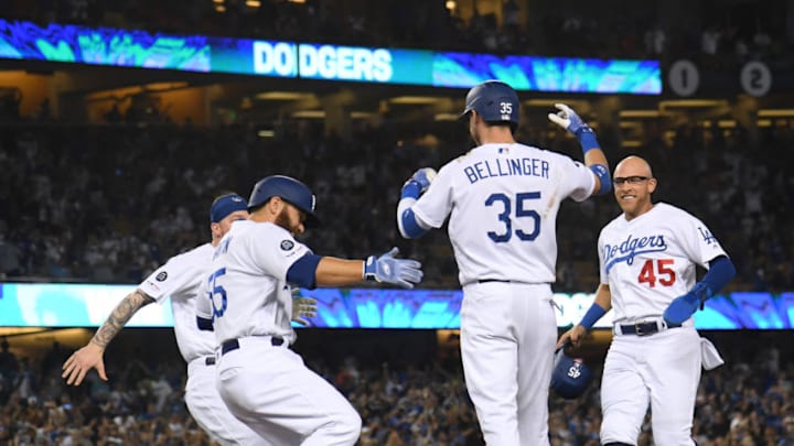 LOS ANGELES, CALIFORNIA - JULY 02: Cody Bellinger #35 of the Los Angeles Dodgers celebrates his bases loaded walk with Russell Martin #55, Matt Beaty #45 and Alex Verdugo #27, to win the game 5-4 over the Arizona Diamondbacks, during the ninth inning at Dodger Stadium on July 02, 2019 in Los Angeles, California. (Photo by Harry How/Getty Images)