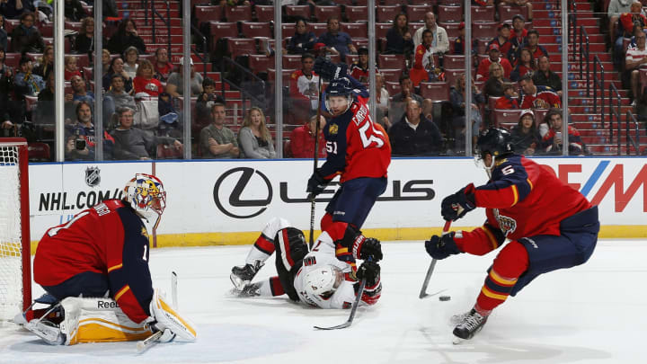 SUNRISE, FL – OCTOBER 13: Kyle Turris #7 of the Ottawa Senators is taken down next to the net by Brian Campbell #51 as Aaron Ekblad #5 clears the puck of the Florida Panthers at the BB&T Center on October 13, 2014 in Sunrise, Florida. (Photo by Joel Auerbach/Getty Images)