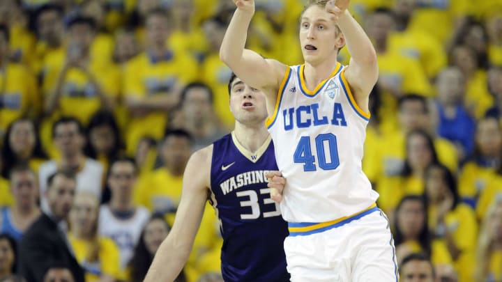 March 1, 2017; Los Angeles, CA, USA; UCLA Bruins center Thomas Welsh (40) passes the ball in front of Washington Huskies forward Sam Timmins (33) during the first half at Pauley Pavilion. Mandatory Credit: Gary A. Vasquez-USA TODAY Sports