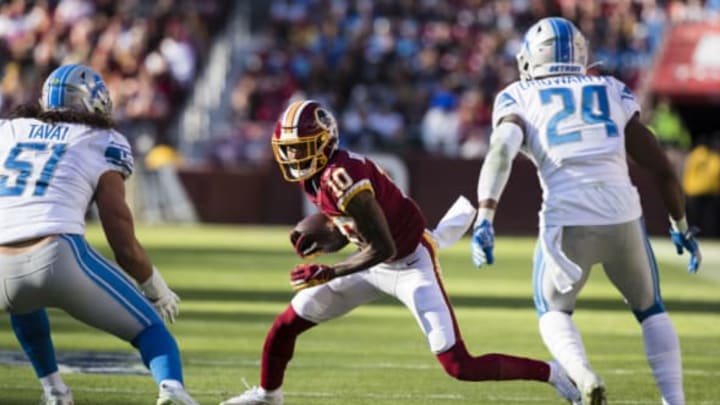 LANDOVER, MD – NOVEMBER 24: Paul Richardson #10 of the Washington Redskins runs after a catch as Jahlani Tavai #51 and Amani Oruwariye #24 of the Detroit Lions defend during the first half at FedExField on November 24, 2019 in Landover, Maryland. (Photo by Scott Taetsch/Getty Images)