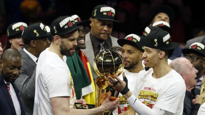 OAKLAND, CALIFORNIA - JUNE 13: Marc Gasol #33 and Danny Green #14 of the Toronto Raptors celebrate with the Larry O'Brien Championship Trophy after his team defeated the Golden State Warriors to win Game Six of the 2019 NBA Finals at ORACLE Arena on June 13, 2019 in Oakland, California. NOTE TO USER: User expressly acknowledges and agrees that, by downloading and or using this photograph, User is consenting to the terms and conditions of the Getty Images License Agreement. (Photo by Lachlan Cunningham/Getty Images)