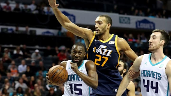 CHARLOTTE, NC - NOVEMBER 30: Kemba Walker #15 of the Charlotte Hornets drives to the basket against Rudy Gobert #27 of the Utah Jazz during their game at Spectrum Center on November 30, 2018 in Charlotte, North Carolina. (Photo by Streeter Lecka/Getty Images)