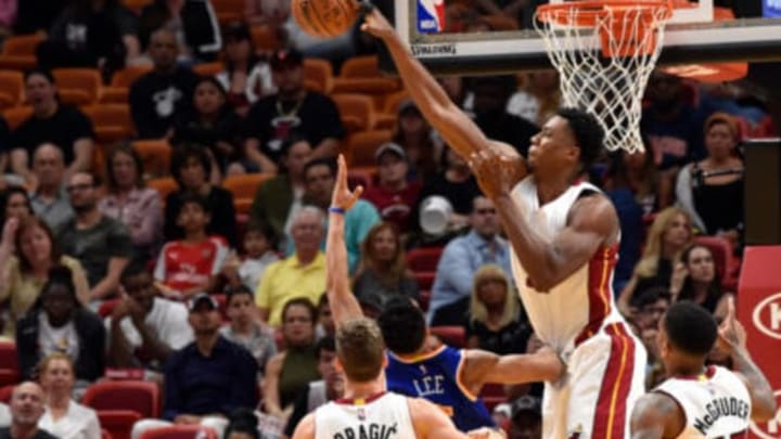 Mar 31, 2017; Miami, FL, USA; Miami Heat center Hassan Whiteside (21) blocks a shot by New York Knicks guard Courtney Lee (5) during the second half at American Airlines Arena. Mandatory Credit: Steve Mitchell-USA TODAY Sports