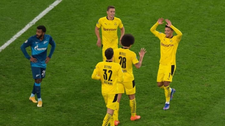 Borussia Dortmund's Belgian midfielder Axel Witsel celebrates with teammates after scoring the team's second goal during the UEFA Champions League football match between Zenit St. Petersburg and Borussia Dortmund at the Saint Petersburg Stadium (Gazprom Arena) in Saint Petersburg on December 8, 2020. (Photo by Olga MALTSEVA / AFP) (Photo by OLGA MALTSEVA/AFP via Getty Images)