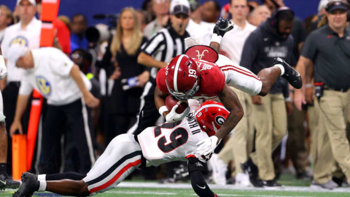 ATLANTA, GEORGIA - DECEMBER 04: Jahleel Billingsley #19 of the Alabama Crimson Tide carries the ball as Christopher Smith #29 of the Georgia Bulldogs defends in the second quarter of the SEC Championship game at Mercedes-Benz Stadium on December 04, 2021 in Atlanta, Georgia. (Photo by Kevin C. Cox/Getty Images)
