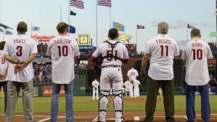 Aug 4, 2013; Philadelphia, PA, USA; Members of the 1993 National League champion Philadelphia Phillies catcher Todd Pratt (3), catcher Darren Daulton (10) manager Jim Fregosi (11) and coach Larry Bowa (10) with current Philadelphia Phillies catcher Carlos Ruiz (51) during national anthem before game against the Atlanta Braves at Citizens Bank Park. The Braves defeated the Phillies, 4-1. Mandatory Credit: Eric Hartline-USA TODAY Sports