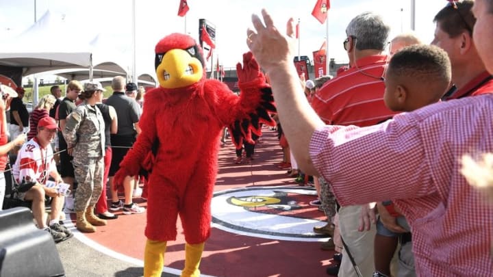 Sep 1, 2016; Louisville, KY, USA; The Louisville Cardinals mascot "Louie" leads the team to the stadium prior to their game against the Charlotte 49ers at Papa John
