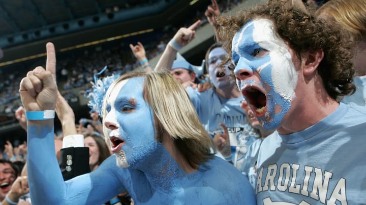 CHAPEL HILL, NC – MARCH 06: Fans cheer before the start of the Duke Blue Devils versus North Carolina Tar Heels game on March 6, 2005 at the Dean E. Smith Center in Chapel Hill, North Carolina. The Tar Heels defeated the Blue Devils 75-73. (Photo by Streeter Lecka/Getty Images)