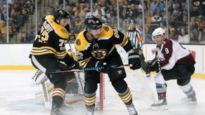 BOSTON, MA - OCTOBER 09: Boston Bruins right defenseman Charlie McAvoy (73) and Boston Bruins right defenseman Kevan Miller (86) defend against Colorado Avalanche center Matt Duchene (9) during a game between the Boston Bruins and the Colorado Avalanche on October 9, 2017, at TD Garden in Boston, Massachusetts. The Avalanche defeated the Bruns 3-0. (Photo by Fred Kfoury III/Icon Sportswire via Getty Images)