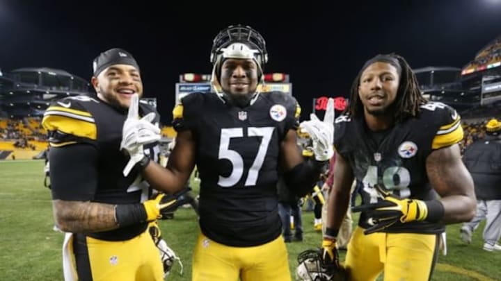 Dec 20, 2015; Pittsburgh, PA, USA; Pittsburgh Steelers fullback Roosevelt Nix-Jones (45) and inside linebacker Terence Garvin (57) and linebacker Bud Dupree (48) celebrate after defeating the Denver Broncos at Heinz Field. The Steelers won 34-27. Mandatory Credit: Charles LeClaire-USA TODAY Sports