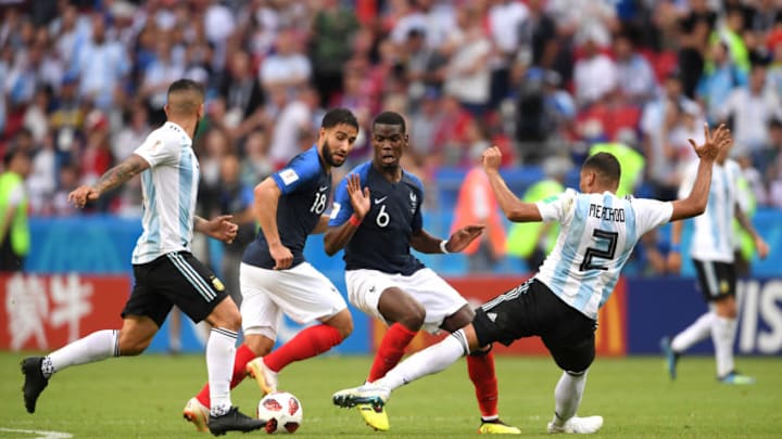KAZAN, RUSSIA - JUNE 30: Paul Pogba and Nabil Fekir of France compete for the ball with Gabriel Mercado of Argentina during the 2018 FIFA World Cup Russia Round of 16 match between France and Argentina at Kazan Arena on June 30, 2018 in Kazan, Russia. (Photo by Laurence Griffiths/Getty Images)