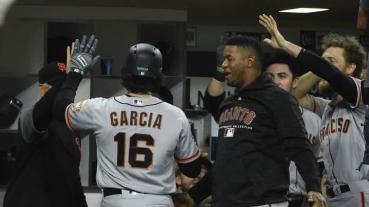 SAN DIEGO, CA - SEPTEMBER 19: Aramis Garcia #16 of the San Francisco Giants is congratulated after hitting a solo home during the eighth inning of a baseball game against the San Diego Padres at PETCO Park on September 19, 2018 in San Diego, California. (Photo by Denis Poroy/Getty Images)