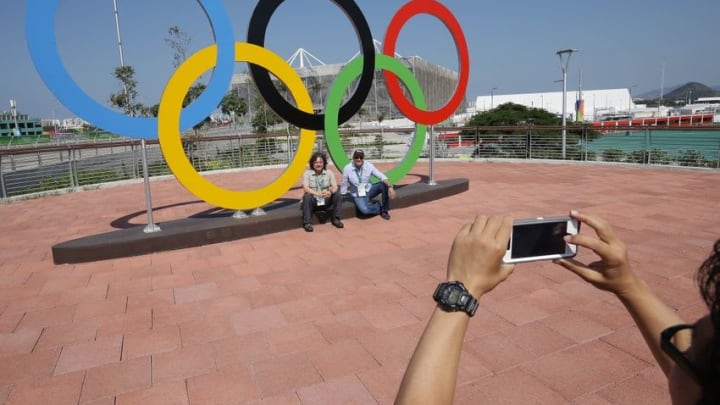 Aug 5, 2016; Rio de Janeiro, Brazil; Fans pose for a photo with the rings in Olympic Park on the day of opening ceremonies for the Rio 2016 Summer Olympic Games. Mandatory Credit: Matt Kryger-USA TODAY Sports