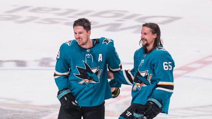 SAN JOSE, CA - APRIL 23: San Jose Sharks center Logan Couture (39) and San Jose Sharks defenseman Erik Karlsson (65) enjoying the moment after winning Game 7, Round 1 between the Vegas Golden Knights and the San Jose Sharks on Tuesday, April 23, 2019 at the SAP Center in San Jose, California. (Photo by Douglas Stringer/Icon Sportswire via Getty Images)
