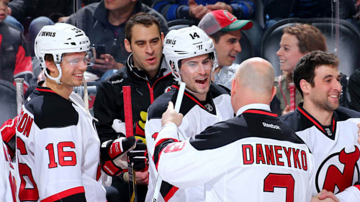 NEWARK, NJ - MARCH 08: 1995 Stanley Cup Champion team member Ken Daneyko of the New Jersey Devils greets current player Adam Henrique